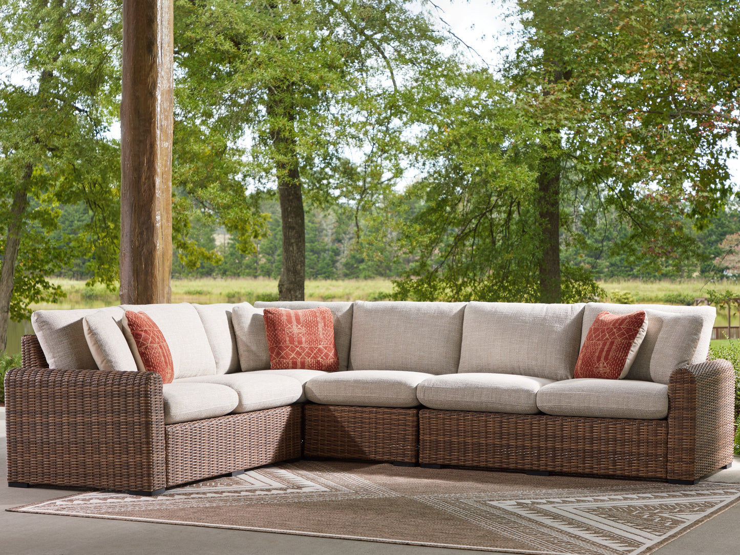 Auburndale Furniture Outlet - Ashley Furniture - Dolan Creek Outdoor - 4-Piece Outdoor Sectional / Beige/Brown - PCP610P2