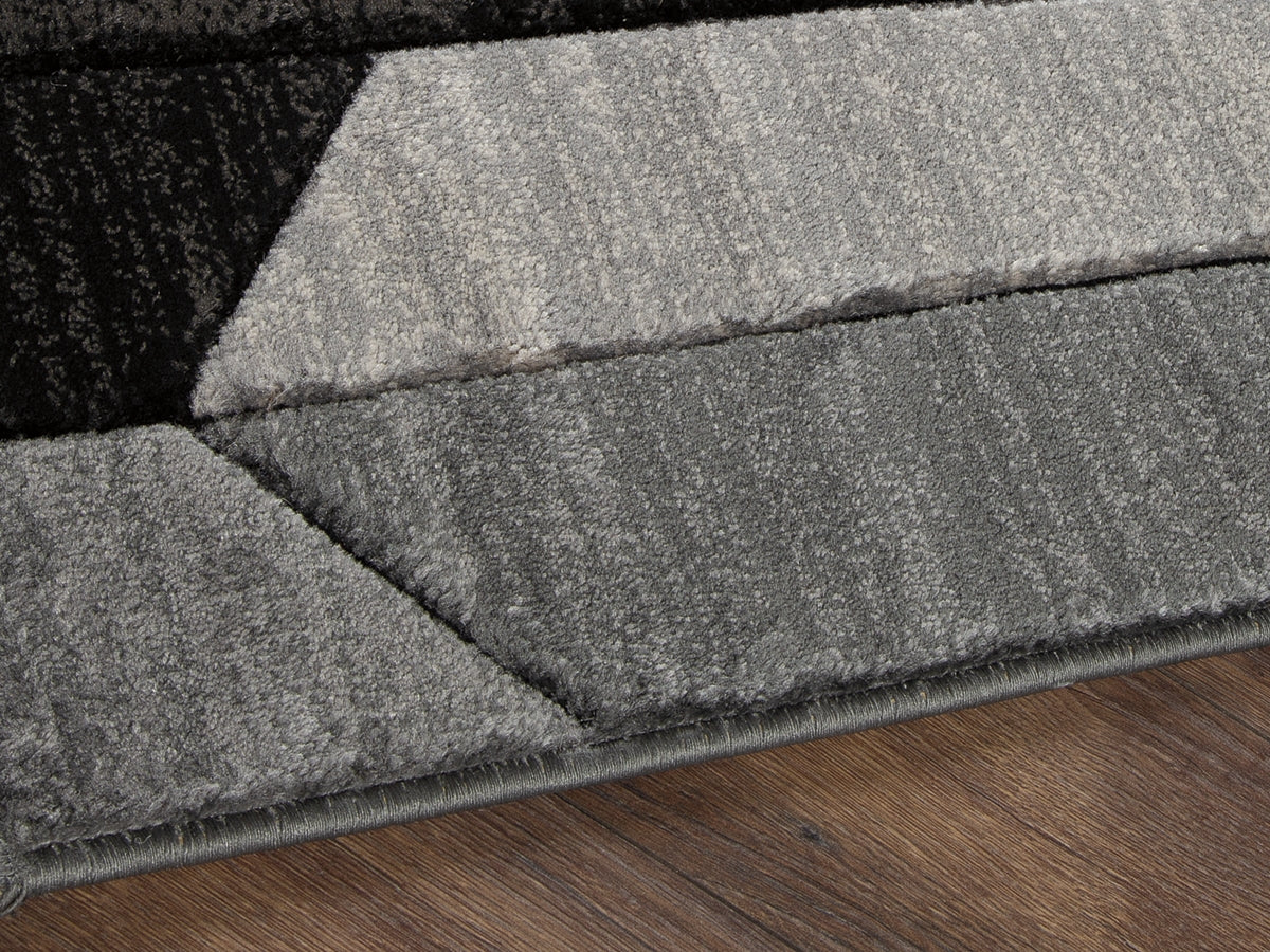 Auburndale Furniture Outlet - Ashley Furniture - Chayse Rug - 5' x 6'7" Rug / Black/Gray - R403462