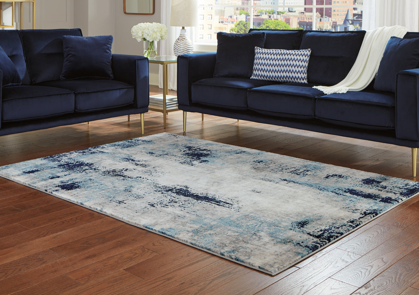 Auburndale Furniture Outlet - Ashley Furniture - Leonelle Rug - 7'10" x 10' Rug / White/Blue/Gray - R404871