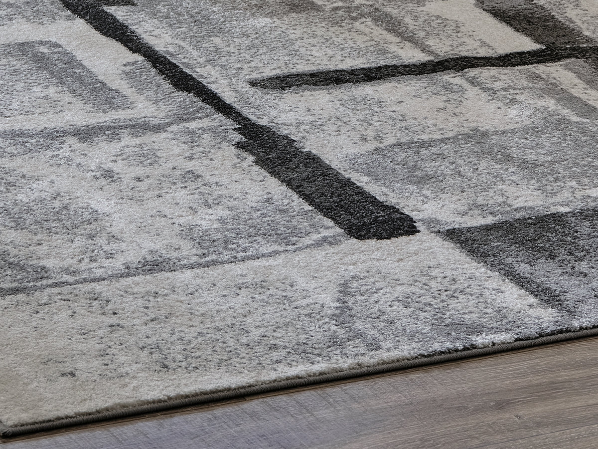 Auburndale Furniture Outlet - Ashley Furniture - Brycebourne Rug - 5'3" x 7'7" Rug / Black/Cream/Gray - R404982