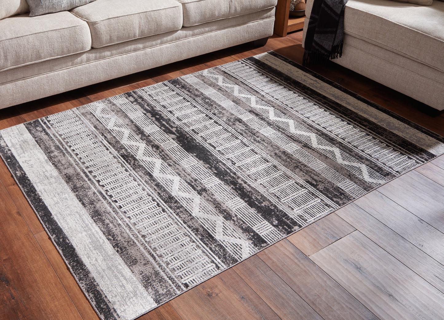 Auburndale Furniture Outlet - Ashley Furniture - Henchester Rug - 5' x 7' Washable Rug / Multi - R405992