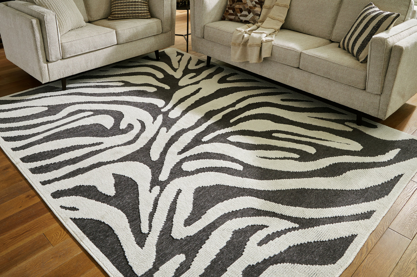 Auburndale Furniture Outlet - Ashley Furniture - Thomwith Rug - 8' x 10'2" Washable Rug / Black/Ivory - R406291