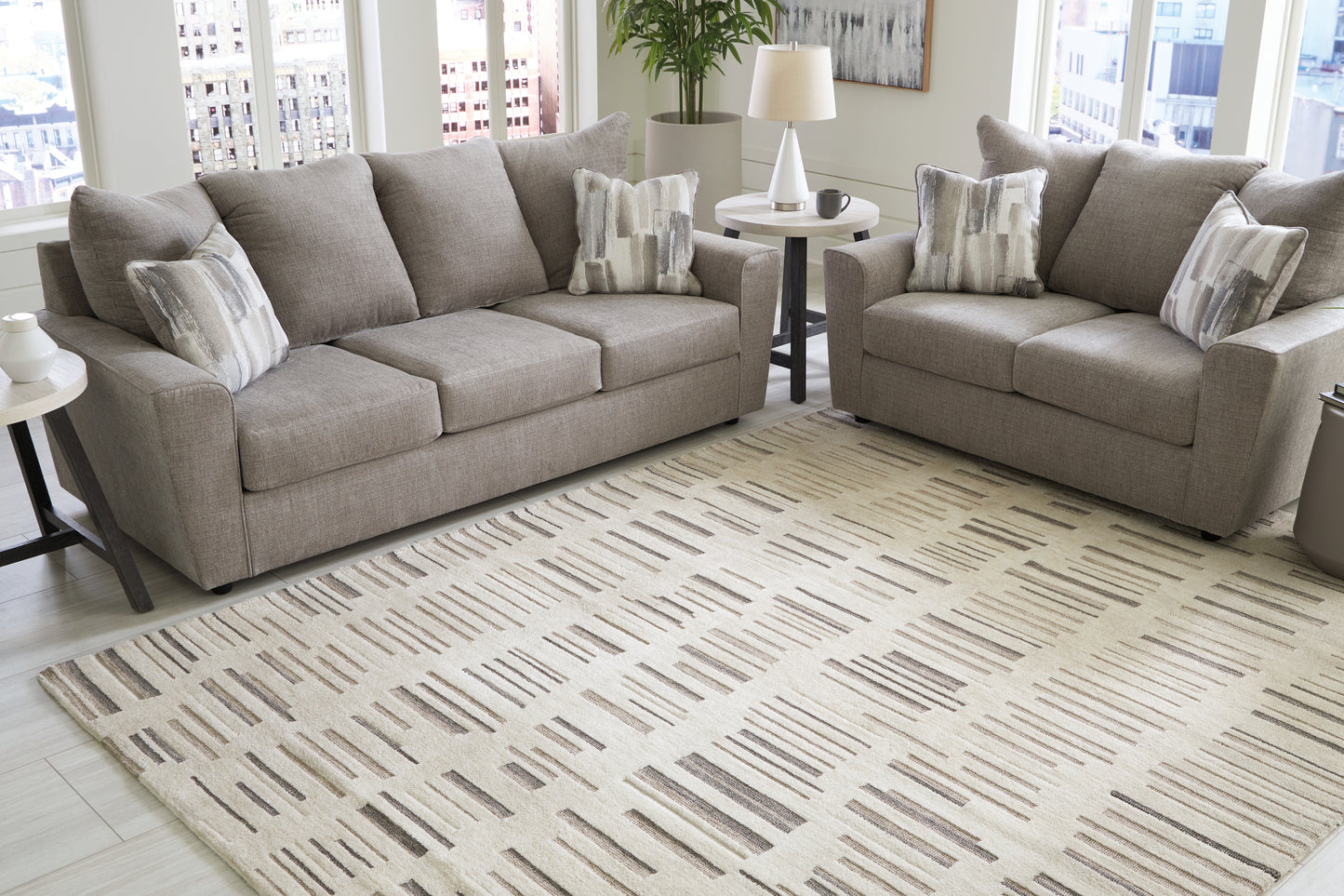 Auburndale Furniture Outlet - Ashley Furniture - Leesdale Rug - 8' x 10' Rug / Ivory/Brown/Black - R406421