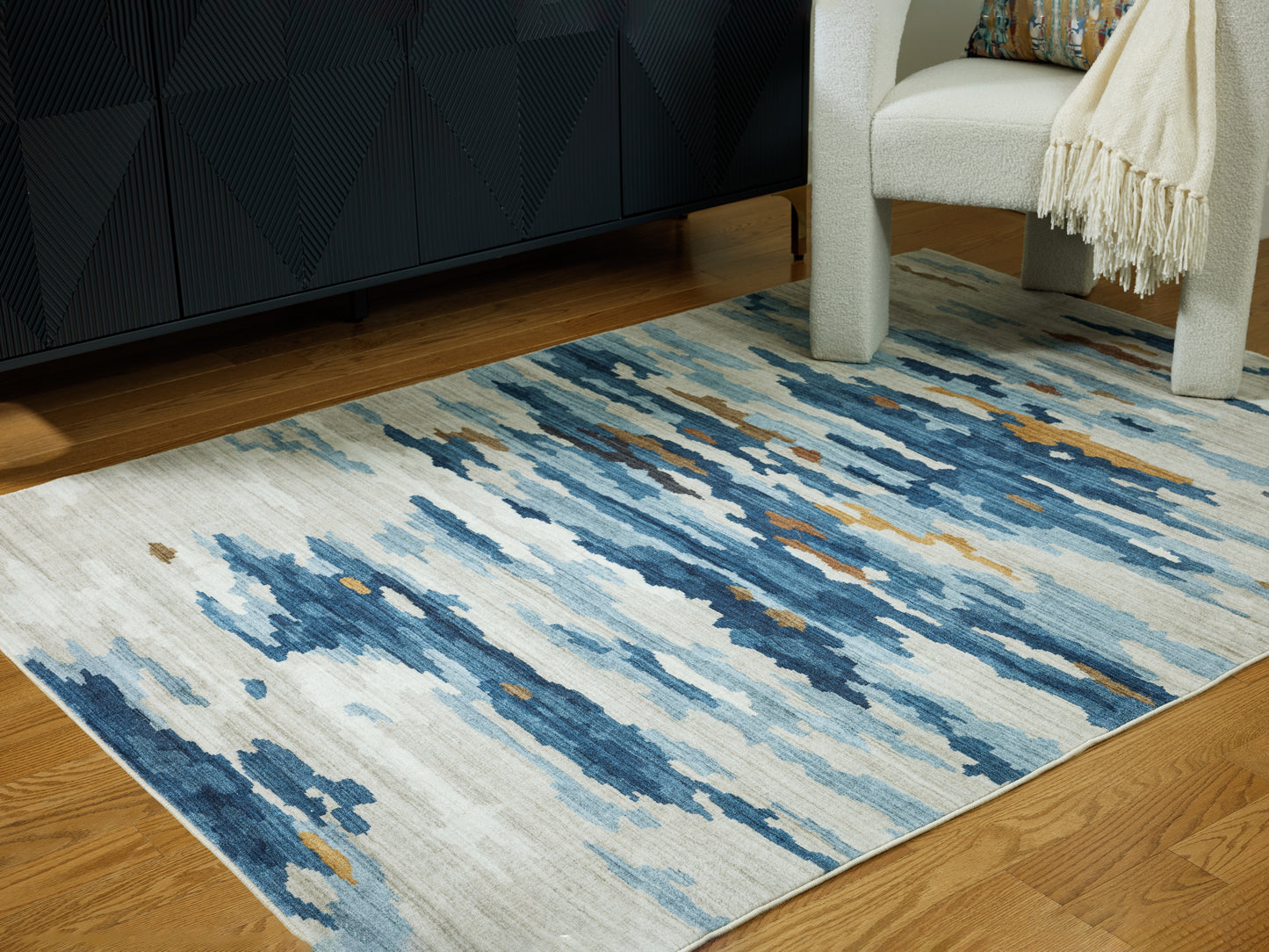 Auburndale Furniture Outlet - Ashley Furniture - Vinlett Rug - 5' x 7' Washable Rug / Cream/Blue/Brown - R407042
