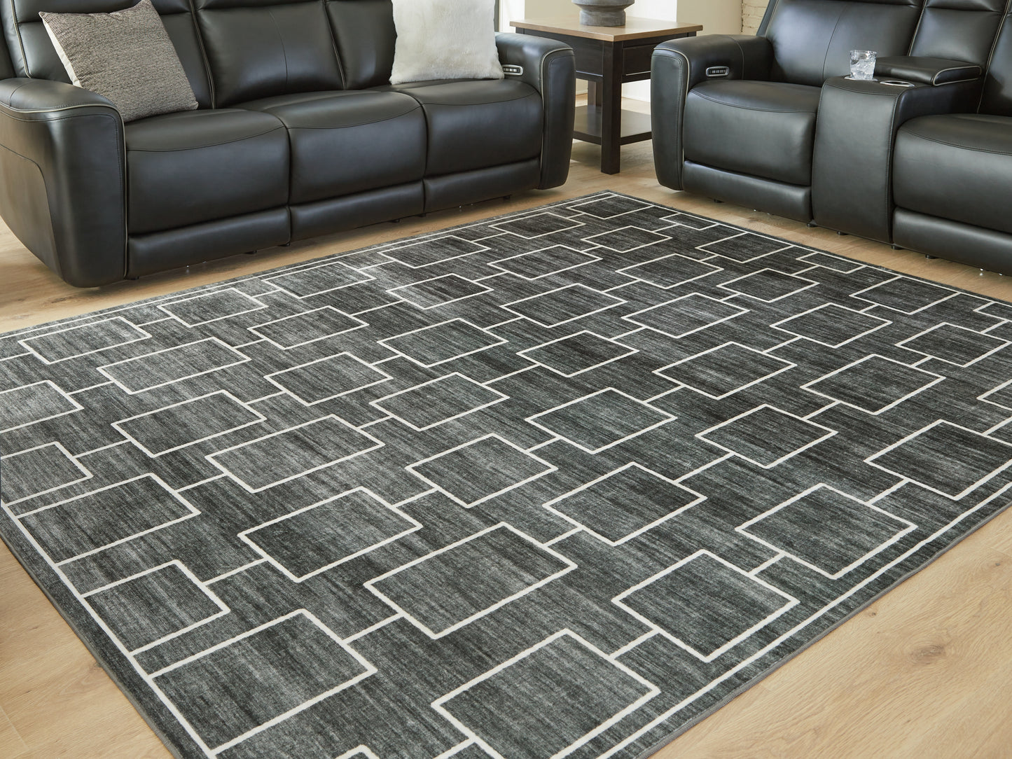 Auburndale Furniture Outlet - Ashley Furniture - Elderland Rug - Washable 7'6" x 9'6" Area Rug / Black/Gray - R407401