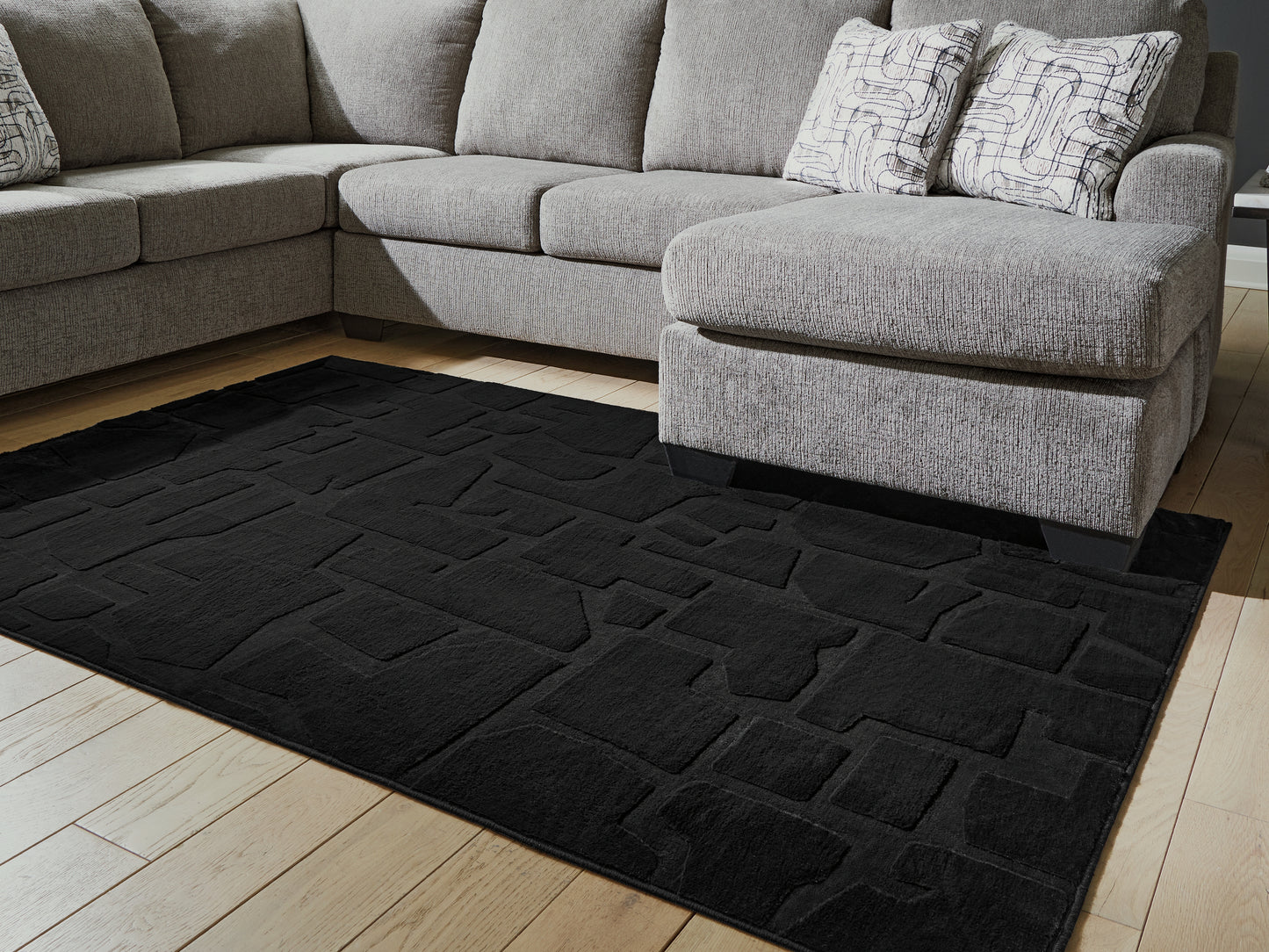 Auburndale Furniture Outlet - Ashley Furniture - Gibbswell Rug - Washable 5' x 7' Area Rug / Black - R407462