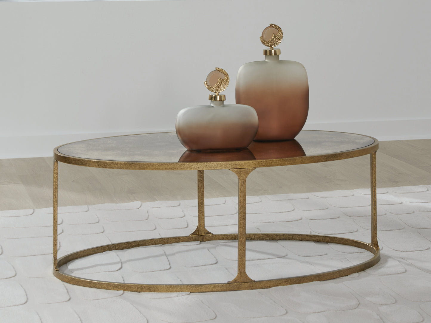 Auburndale Furniture Outlet - Ashley Furniture - Korajane Coffee Table - Oval Cocktail Table / Antique Gold - T399-0