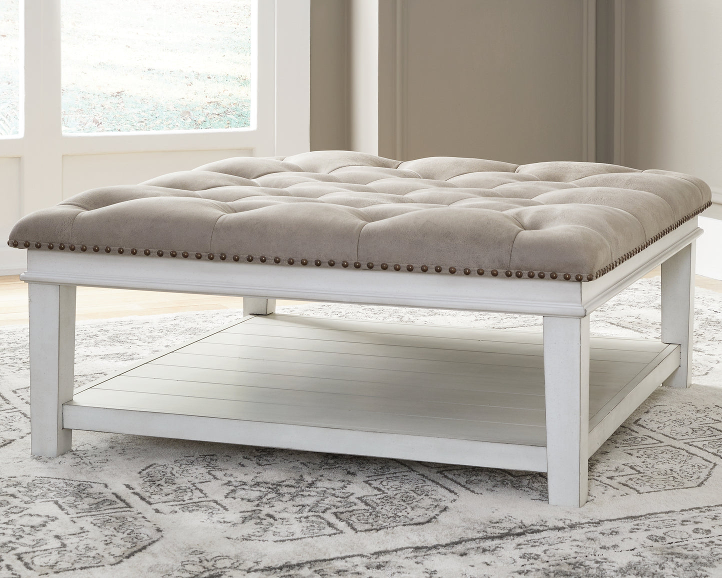 Auburndale Furniture Outlet - Ashley Furniture - Kanwyn Upholstered Ottoman Coffee Table - UPH Ottoman Cocktail Table / Whitewash - T937-21