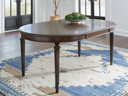 Auburndale Furniture Outlet - Ashley Furniture - Lavinton Dining Room - Oval Dining Room EXT Table / Brown - D764-35