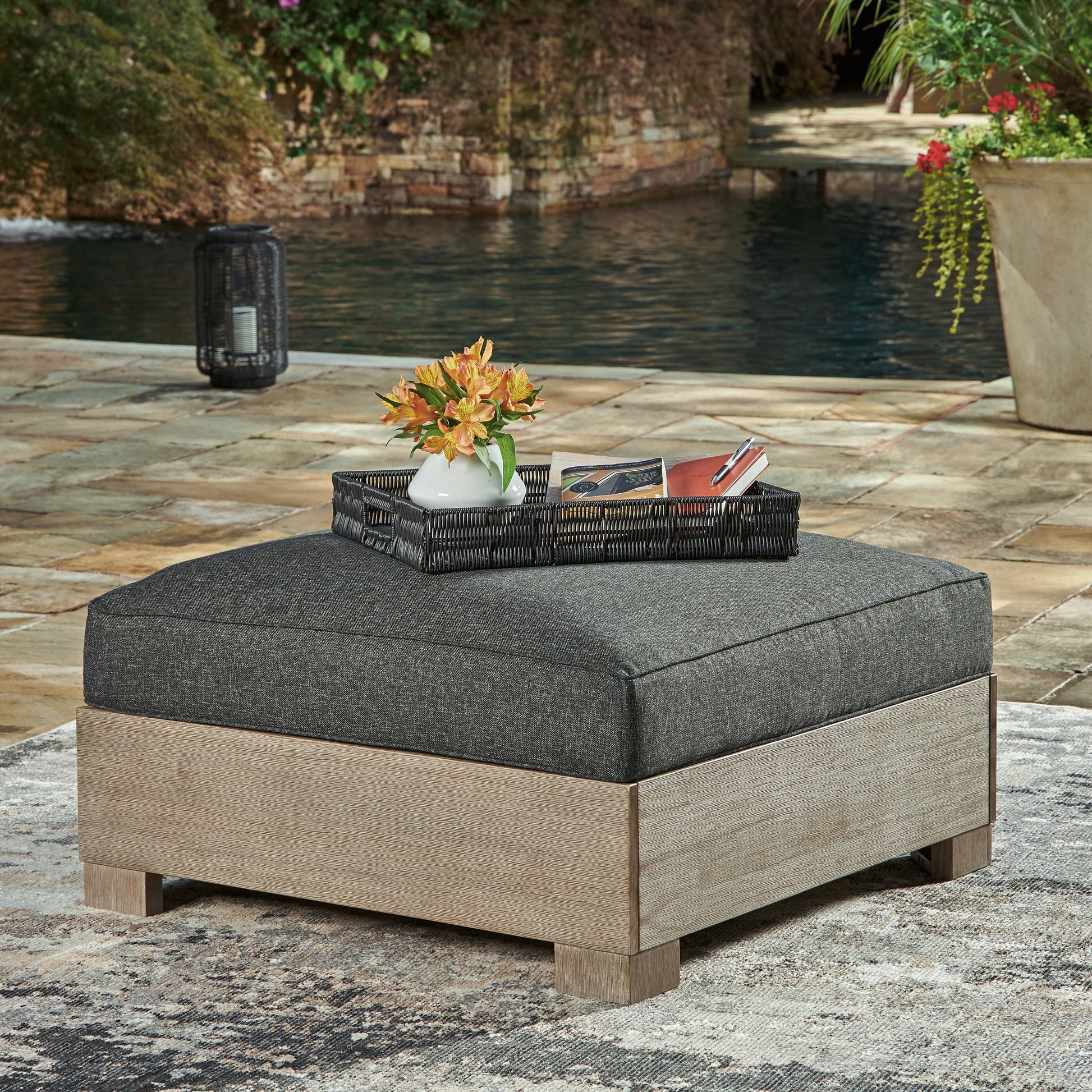 Auburndale Furniture Outlet - Ashley Furniture - Citrine Park Outdoor - Ottoman with Cushion / Brown/Charcoal - P660-814