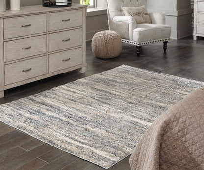 Auburndale Furniture Outlet - Ashley Furniture - Gizela Rug - 7'10" x 10' Rug / Ivory/Beige/Gray - R404861