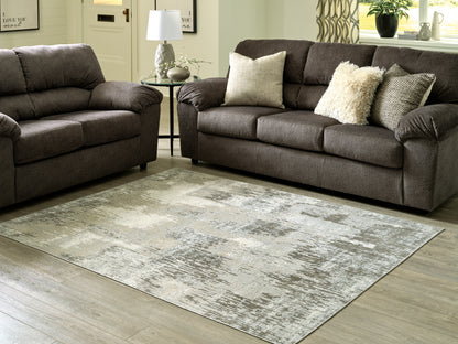 Auburndale Furniture Outlet - Ashley Furniture - Arriston Rug - 7'10" x 10' Washable Rug / Multi - R405561