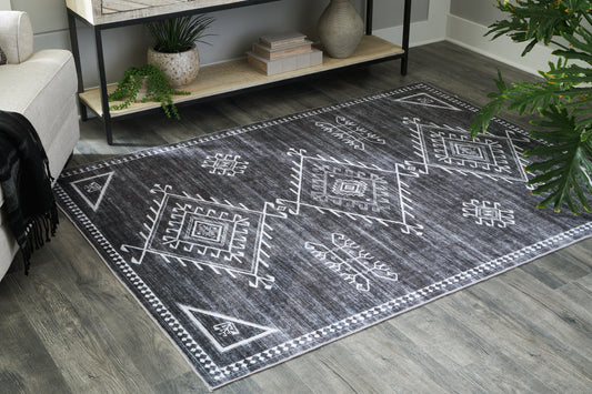 Auburndale Furniture Outlet - Ashley Furniture - Arloman Rug - 5' x 7' Washable Rug / Black/Cream/Gray - R405932