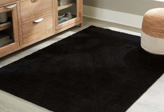 Auburndale Furniture Outlet - Ashley Furniture - Anaben Rug - 5' x 7' Washable Rug / Black - R406312