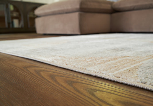 Auburndale Furniture Outlet - Ashley Furniture - Truward Rug - 5' x 7' Rug / Linen/Gray/Caramel - R406472