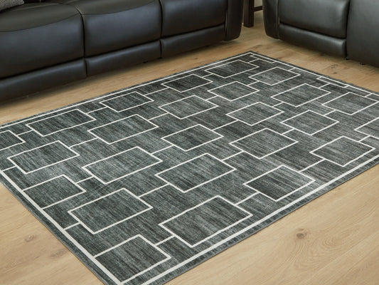 Auburndale Furniture Outlet - Ashley Furniture - Elderland Rug - Washable 7'6" x 9'6" Area Rug / Black/Gray - R407401