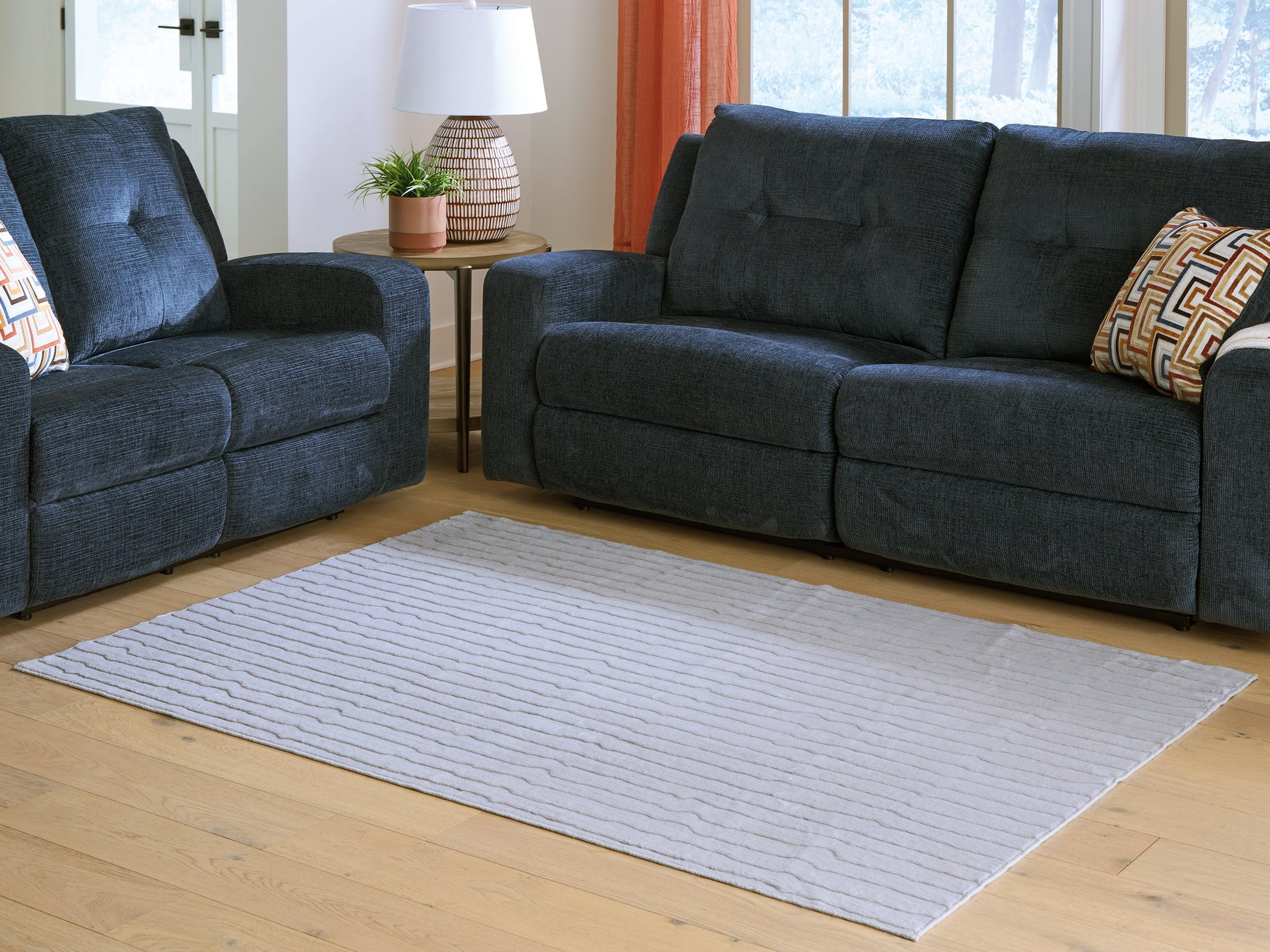 Auburndale Furniture Outlet - Ashley Furniture - Worthley Rug - Washable 5' x 7' Area Rug / Gray - R407452