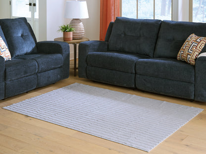 Auburndale Furniture Outlet - Ashley Furniture - Worthley Rug - Washable 5' x 7' Area Rug / Gray - R407452