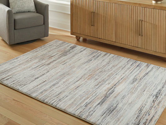 Auburndale Furniture Outlet - Ashley Furniture - Nace Rug - 7'6" x 9'6" Area Rug / Gray/Brown/White - R407471
