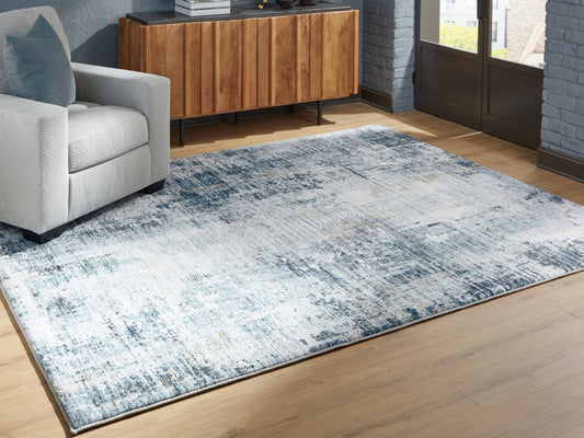 Auburndale Furniture Outlet - Ashley Furniture - Arlenmont Rug - 7'6" x 9'6" Area Rug / Blue/White/Brown - R407481