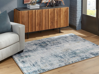 Auburndale Furniture Outlet - Ashley Furniture - Arlenmont Rug - 5' x 7' Area Rug / Blue/White/Brown - R407482