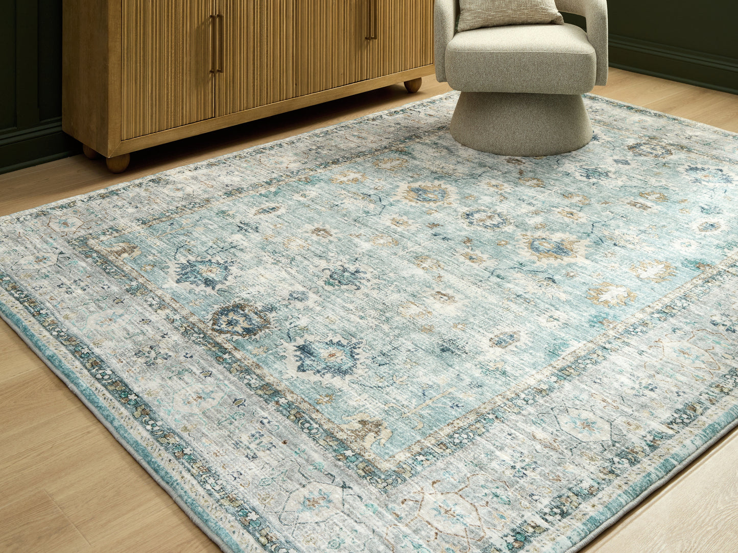 Auburndale Furniture Outlet - Ashley Furniture - Ladstoney Rug - 5' x 7' Area Rug / Teal/Beige/Ochre - R407502