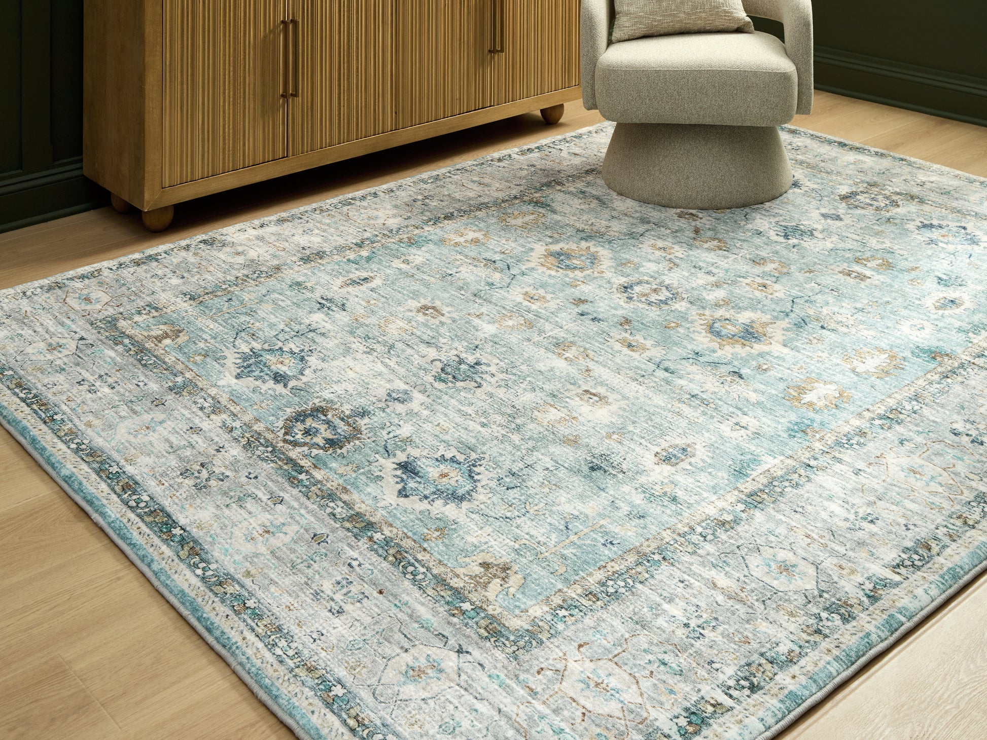 Auburndale Furniture Outlet - Ashley Furniture - Ladstoney Rug - 5' x 7' Area Rug / Teal/Beige/Ochre - R407502