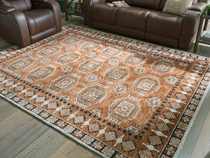 Auburndale Furniture Outlet - Ashley Furniture - Qaabiz Rug - 7'8" x 10' Area Rug / Sienna/Ivory/Black - R407521