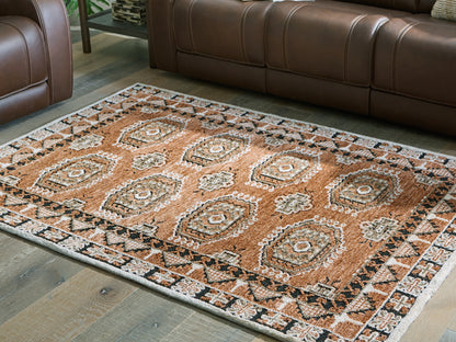 Auburndale Furniture Outlet - Ashley Furniture - Qaabiz Rug - 5' x 7' Area Rug / Sienna/Ivory/Black - R407522