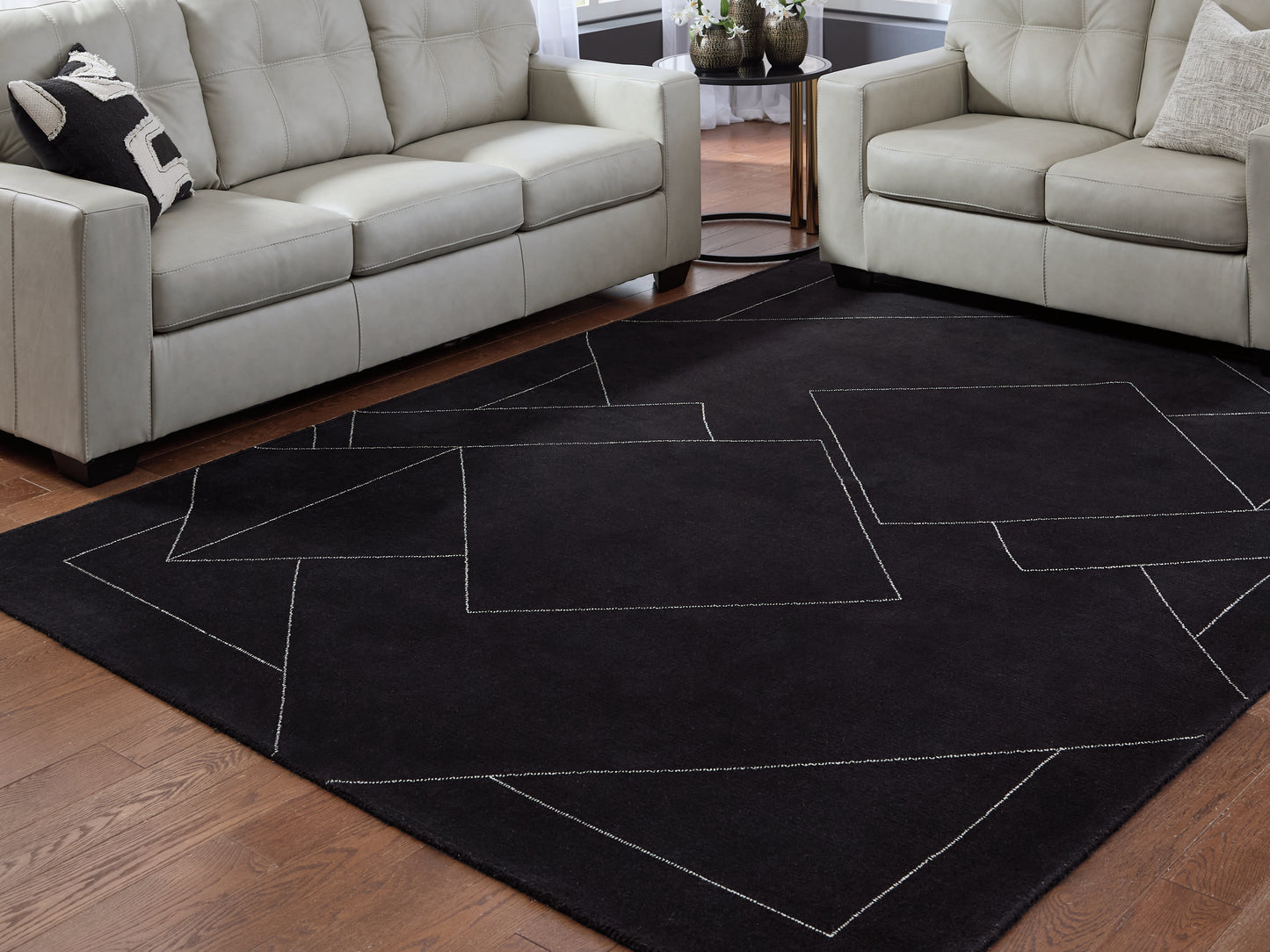 Auburndale Furniture Outlet - Ashley Furniture - Marav Rug - 7'8" x 10' Area Rug / Black/White - R407531