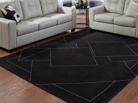Auburndale Furniture Outlet - Ashley Furniture - Marav Rug - 7'8" x 10' Area Rug / Black/White - R407531