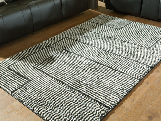 Auburndale Furniture Outlet - Ashley Furniture - Kurtmen Rug - 5' x 7' Area Rug / Black/Ivory - R407592