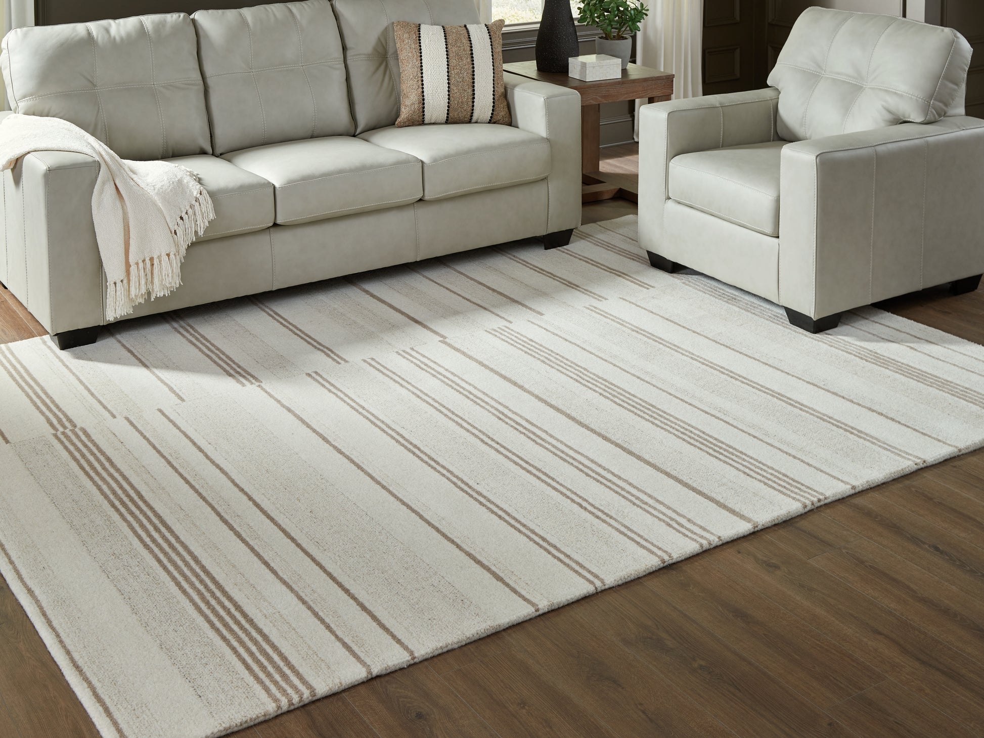 Auburndale Furniture Outlet - Ashley Furniture - Gadence Rug - 5' x 7' Area Rug / Ivory/Tan - R407642