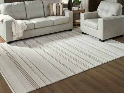 Auburndale Furniture Outlet - Ashley Furniture - Gadence Rug - 5' x 7' Area Rug / Ivory/Tan - R407642