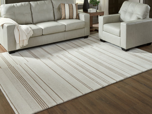 Auburndale Furniture Outlet - Ashley Furniture - Gadence Rug - 5' x 7' Area Rug / Ivory/Tan - R407642