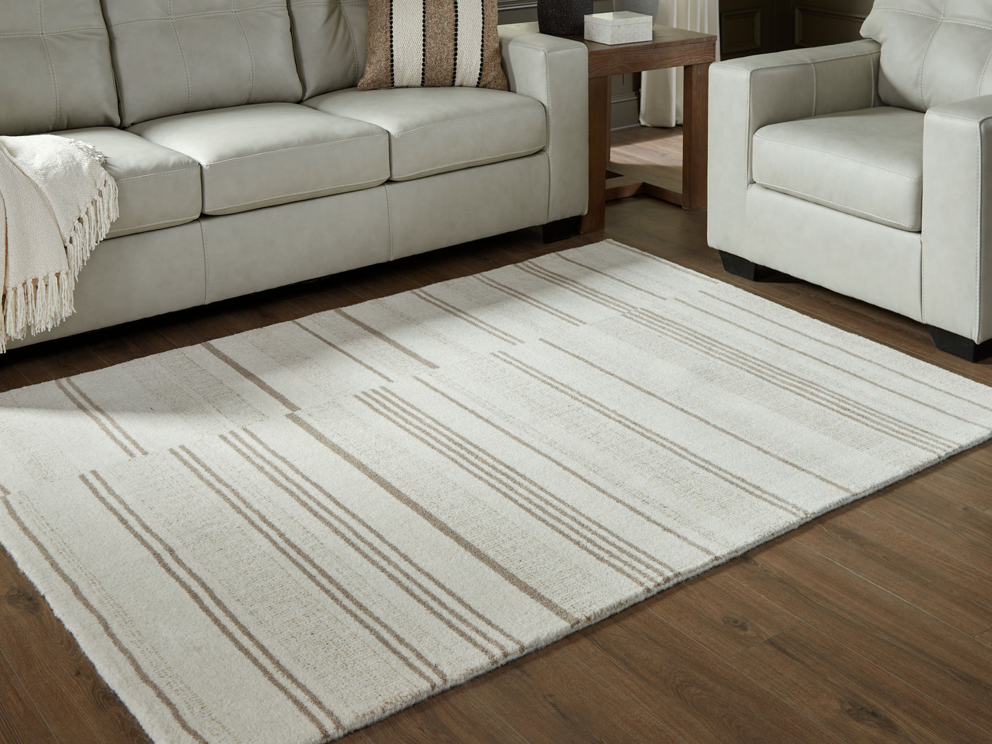 Auburndale Furniture Outlet - Ashley Furniture - Gadence Rug - 5' x 7' Area Rug / Ivory/Tan - R407642