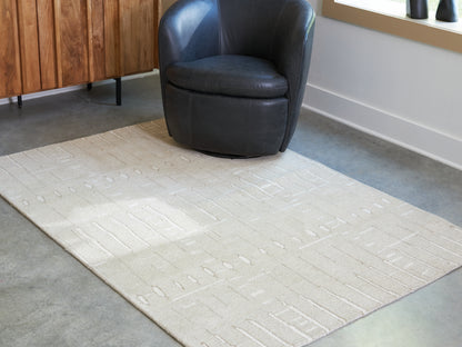 Auburndale Furniture Outlet - Ashley Furniture - Wolbert Rug - 5' x 7' Area Rug / Tan/Ivory - R407662