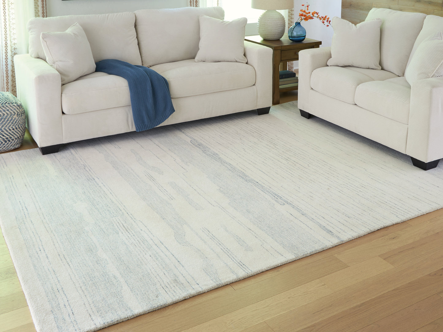 Auburndale Furniture Outlet - Ashley Furniture - Genemost Rug - 7'8" x 10' Area Rug / Ivory/Blue - R407841