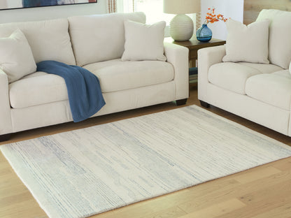 Auburndale Furniture Outlet - Ashley Furniture - Genemost Rug - 5' x 7' Area Rug / Ivory/Blue - R407842