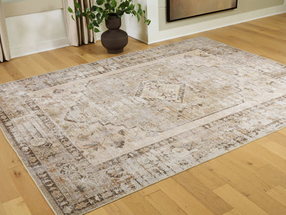 Auburndale Furniture Outlet - Ashley Furniture - Livdon Rug - Washable Large Rug / Brown/Beige/Gray - R407911